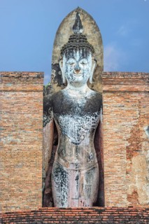 Buddha statue at the ruins of Wat Phra Si Rattana Mahathat temple complex