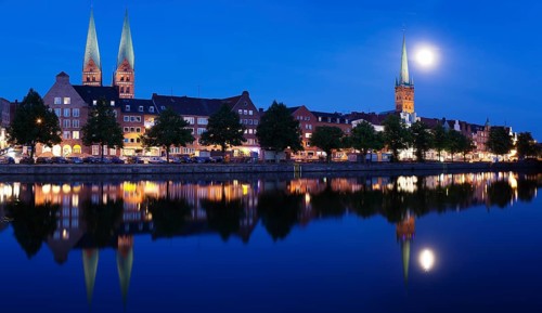 Trave river and the historic centre at full moon