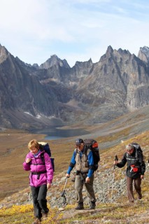 People hiking in arctic or subalpine tundra