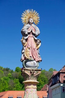 Madonna with a crescent moon on the Marienbrunnen fountain on Marktplatz square