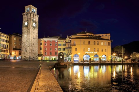 Torre Apponale tower and Lake Garda by night