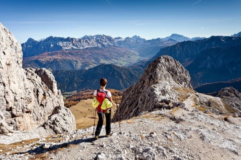 Mountain climber descending from Peitlerkofel Mountain in Puez-Geisler Nature Park