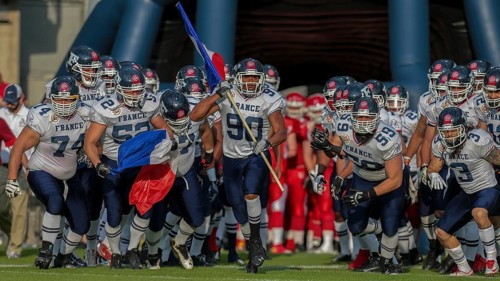 Team France running onto the field for their game against Denmark