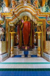 Statue in the old Buddhist temple complex of Sri Pushparama Maha Viharaya