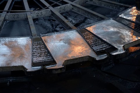 Liquid silver is being poured into molds