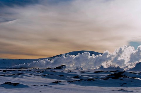 Geyser in a snow-covered landscape