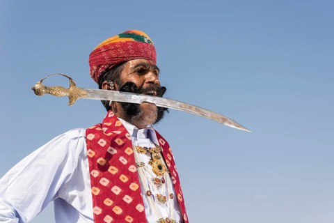 Local man posing with a sword in his mouth