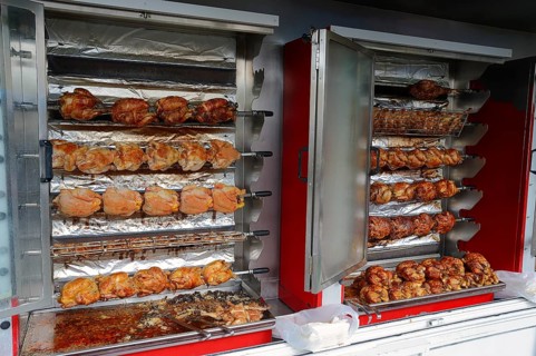 Market stall with a chicken grill and fried chicken