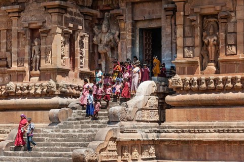 Devout Hindus and children descending a staircase