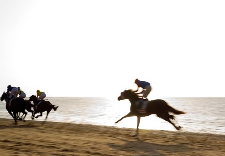 Horse race at the beach of Sanlucar de Barrameda at the Guadalquivir river mouth