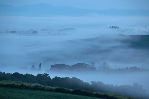 Early morning fog in the valleys of the Crete Senesi