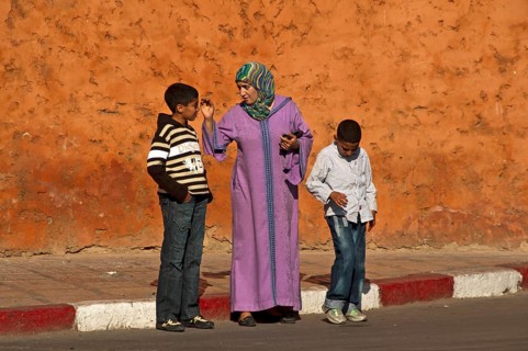 Mother in traditional dress with djellaba and headscarf