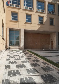 Entrance to a school with a marble mosaic