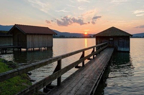 Boathouses at sunset on Lake Kochel
