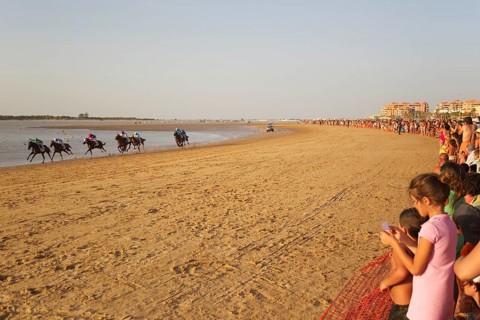 Horse race at the beach of Sanlucar de Barrameda at the Guadalquivir river mouth