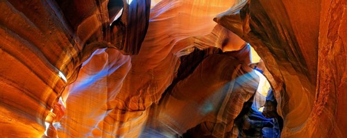 Rays of light falling on yellow-red sandstone formations