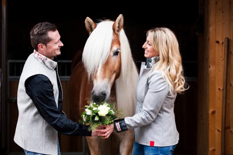 Man giving a woman flowers