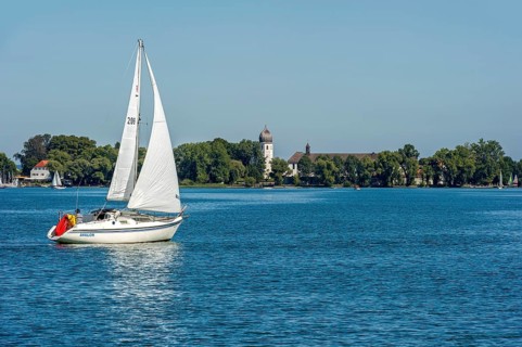 Sailboat in front of Frauenchiemsee Island