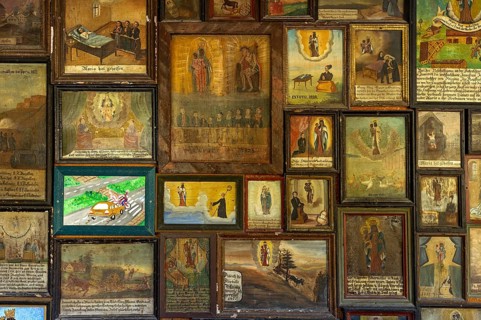 Old and newer votive offerings in the cloister around the Shrine of Our Lady of Altotting