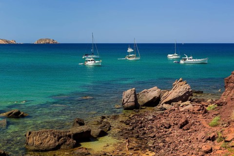 Sailing boats off the coast
