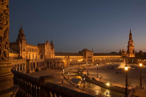 The illuminated Plaza de Espana at dusk