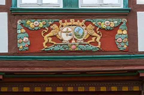 Wood carvings on the framework of the half-timbered house of the former inn 'Zum Goldenen Lowen'