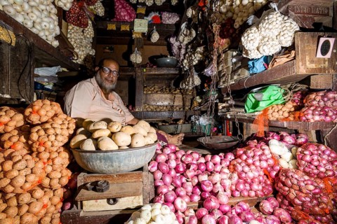 Man selling potatoes and onions at Crawfort Market