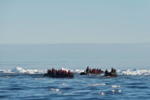 Tourists in inflatable boats
