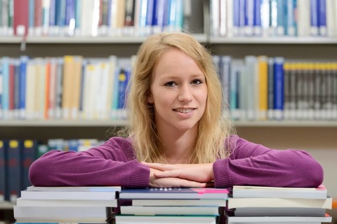 Student studying in the departmental library of the University of Hohenheim in Schloss Hohenheim Palace