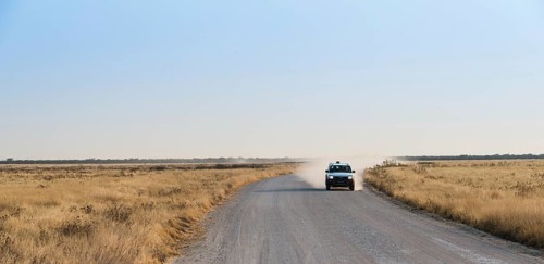 Car travelling on a dirt road