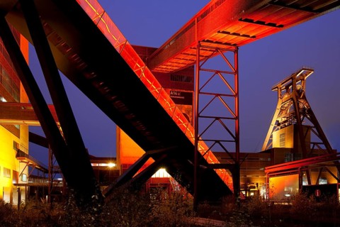 Illuminated gangway to the Ruhr Museum at the Zeche Zollverein Coal Mine Shaft XII with the headframe