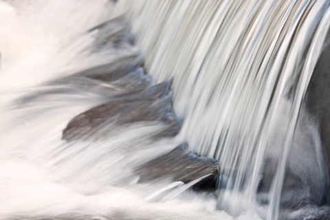Mountain stream with small waterfall