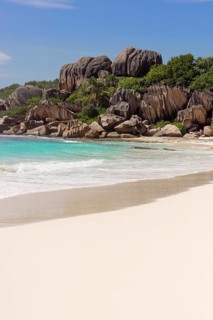 Sandy beach with the rock formations typical for the Seychelles