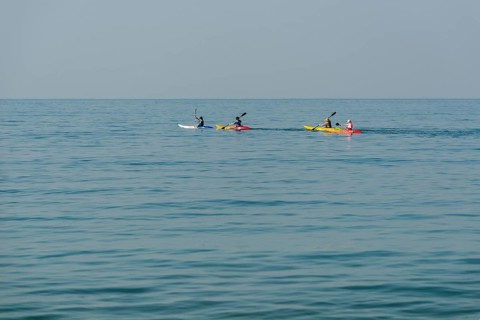 Kayakers in the open sea
