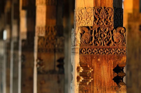 Carved wooden column at a Buddhist shrine of Sri Dalada Maligawa