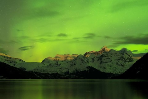 Aurora borealis and moonlight on Mt Gilbert in the Chugach Range