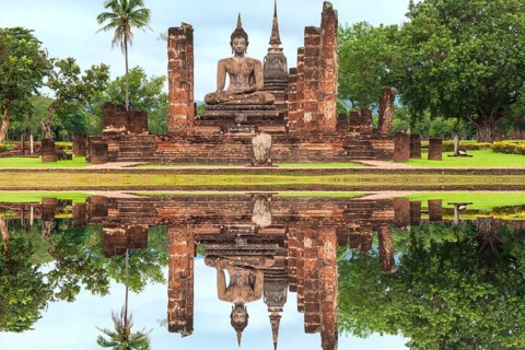 Buddha statue at the ruins of Wat Phra Si Rattana Mahathat temple complex