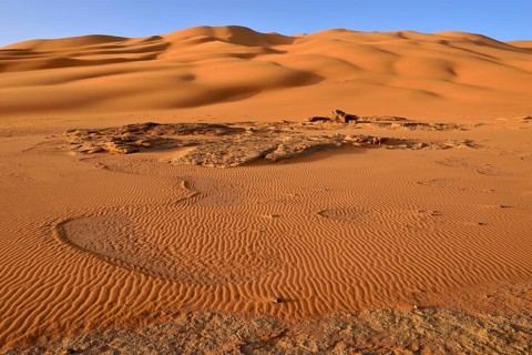 Sand dunes and sandstone rocks at Oued In Djerane