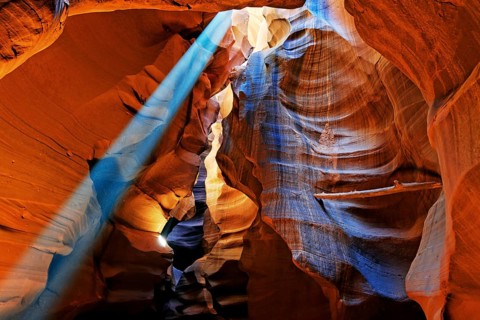 Rays of light falling on yellow-red sandstone formations