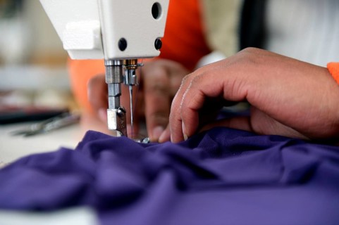Seamstress working on a sewing machine