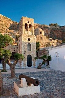 Main square of the lower town with the bell tower of the Byzantine Greek-Orthodox Church of Christ Elkomenos