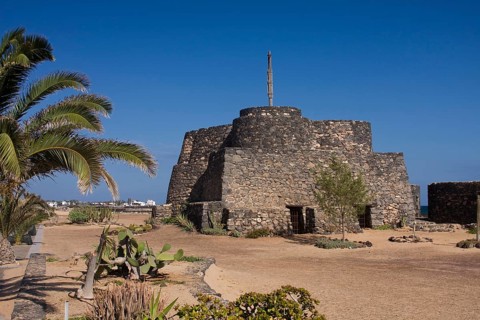 Historic fortress complex on the beach promenade of Caleta de Fuste