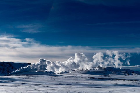 Geyser in a snow-covered landscape
