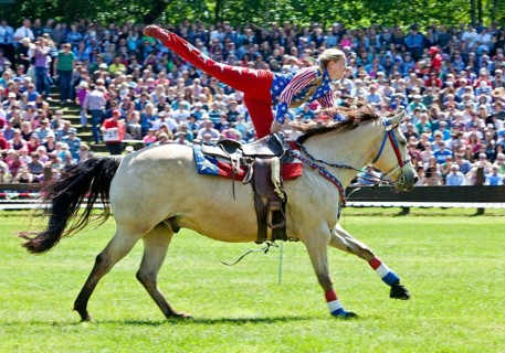 Trick riding in an arena
