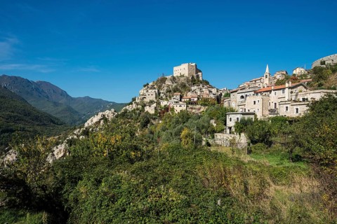 Medieval village with a castle in the mountains