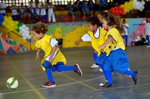 Soccer tournament with children on the sports ground of a slum