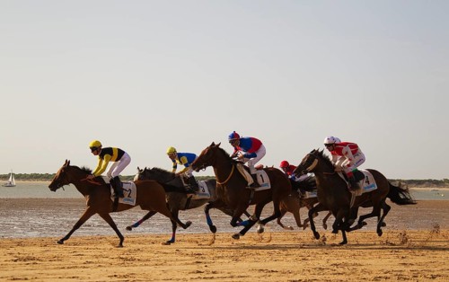 Horse race at the beach of Sanlucar de Barrameda at the Guadalquivir river mouth