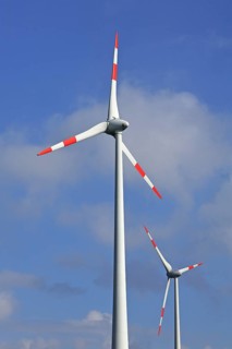 Wind turbines against blue sky