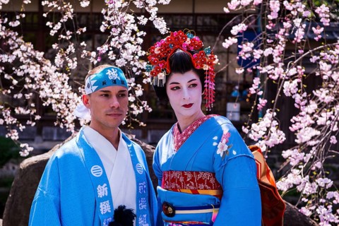 Traditionally dressed mand geisha in the Geisha quarter Gion