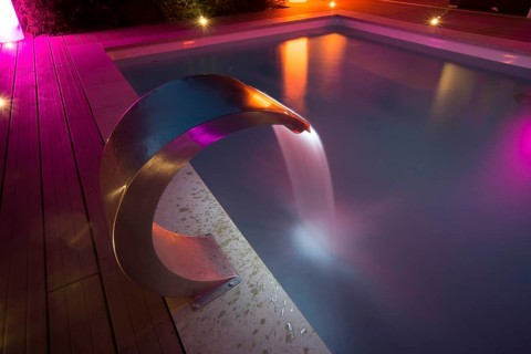 Private pool with a waterfall and terrace